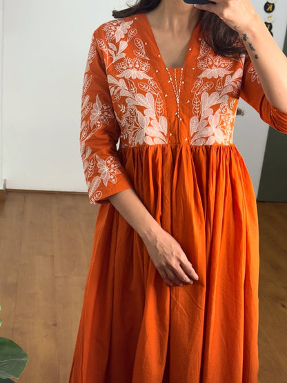 Rust colour Kurta with elegant embroidery work.