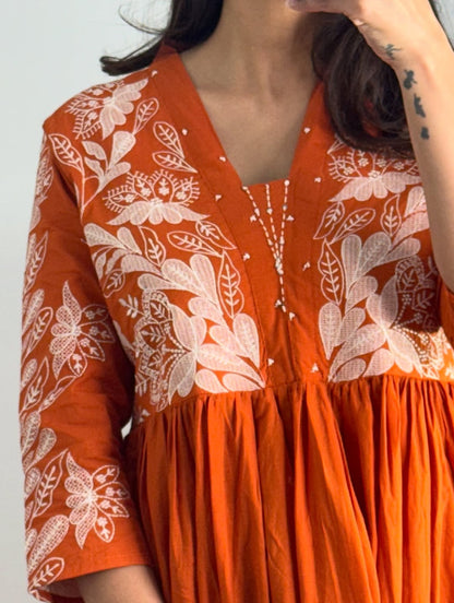 Rust colour Kurta with elegant embroidery work.