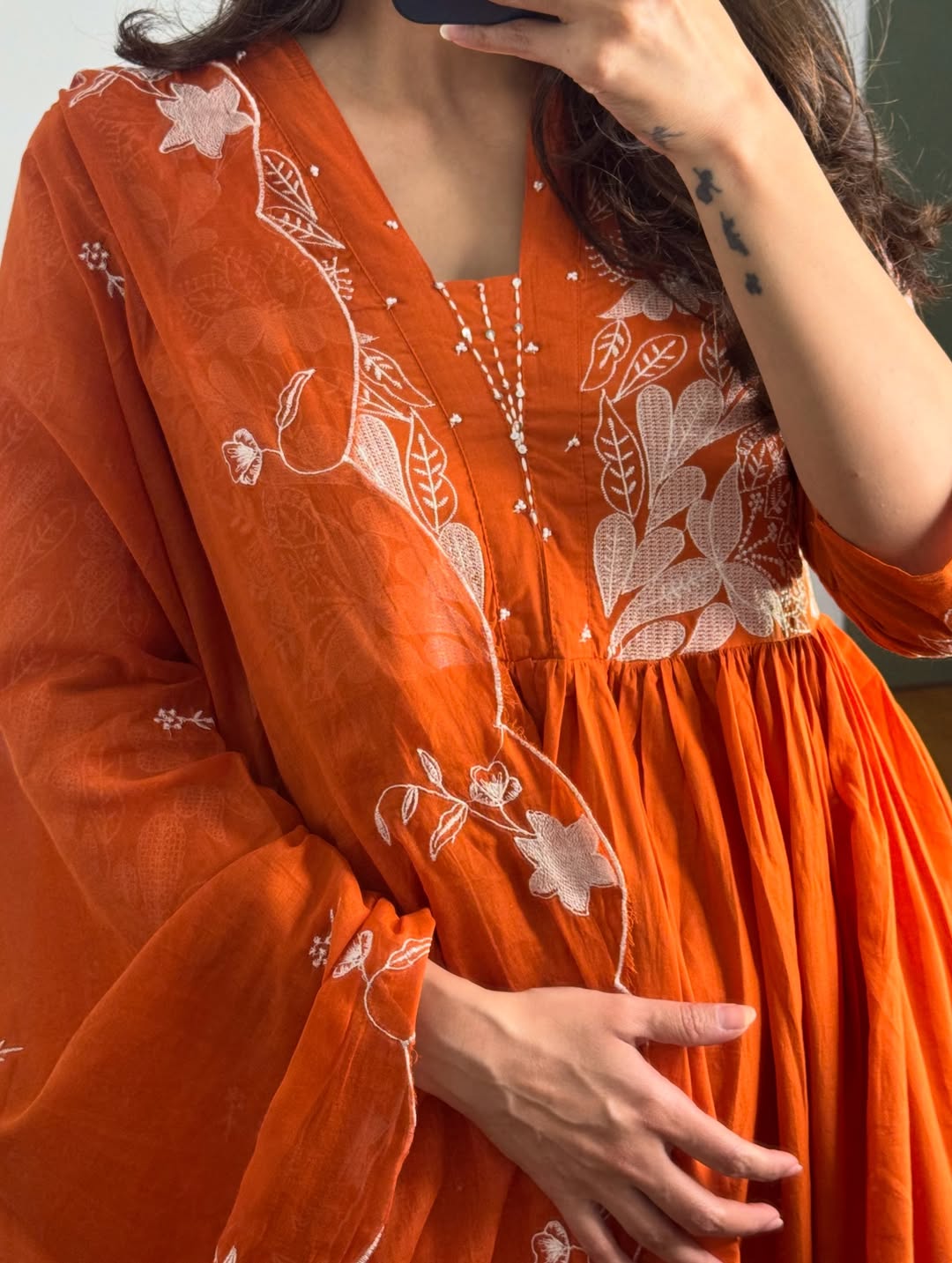 Rust colour Kurta with elegant embroidery work.